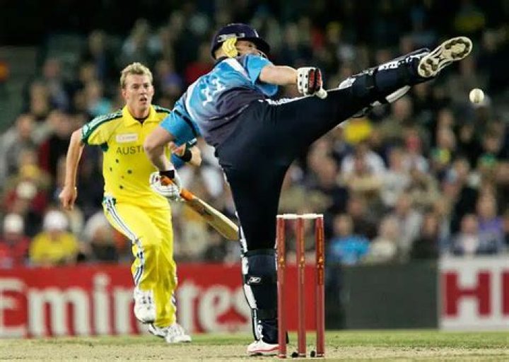 Can a batsman kick the ball in cricket?