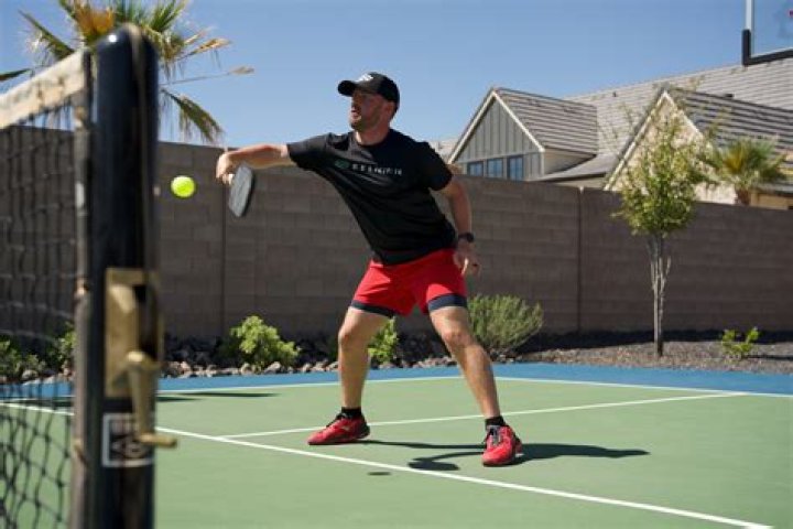 Can a player return the ball before it bounces on their court?