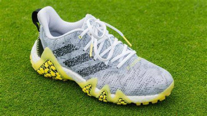 Can I play golf in sneakers?