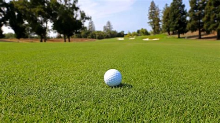 Can you pick up and clean a golf ball in the fairway?