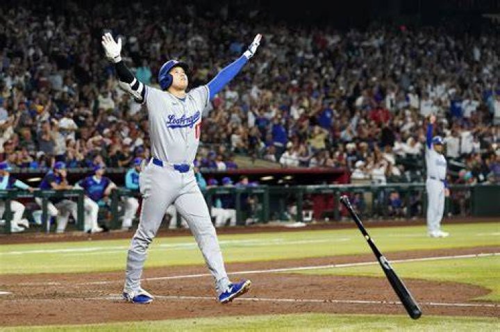 Can you step on home plate after hitting?