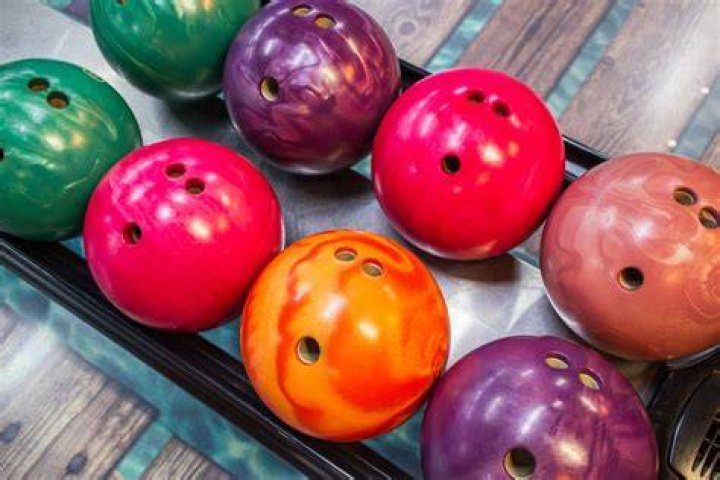 Do bowling balls come with holes?