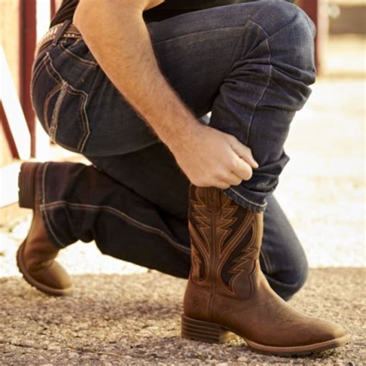 How do cowboys walk in boots?