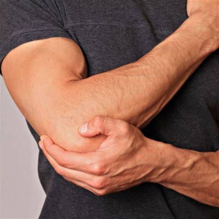 How do I know if I tore a tendon in my elbow?