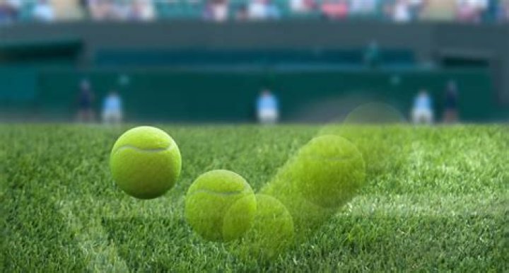 How do tennis balls bounce on grass?