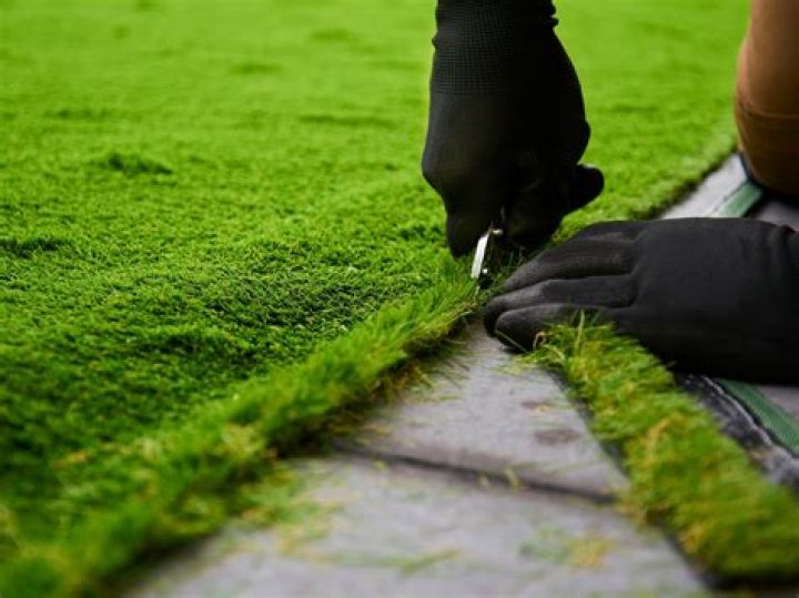 How do you stick down artificial grass on wood?