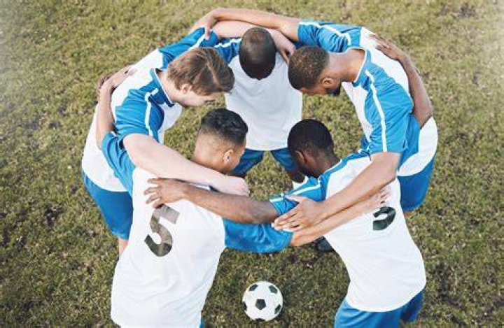 How does football help with teamwork?