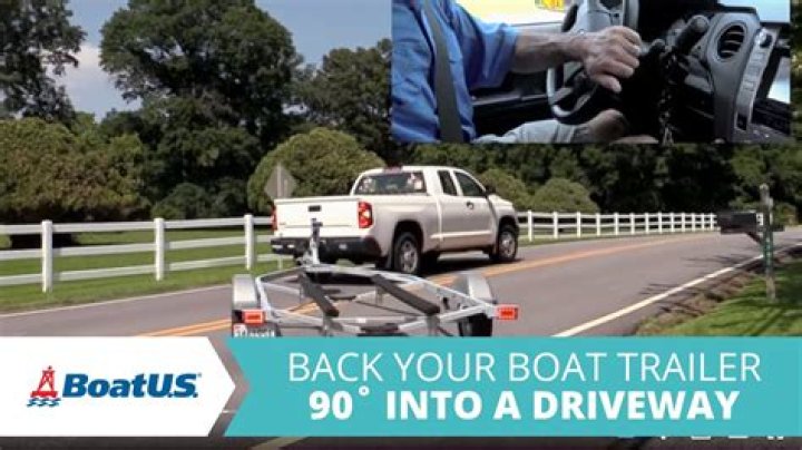 How far do you back a boat trailer into the water?