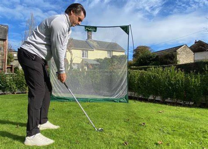 How high does a golf practice net need to be?