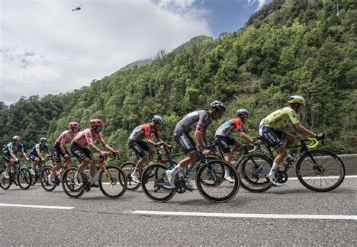 How long do Tour de France riders ride each day?