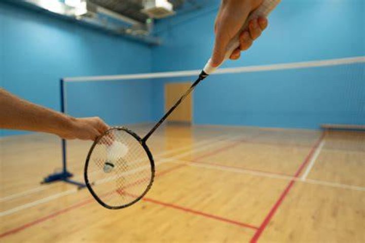 How many attempts does a player get to hit the serve over the net?