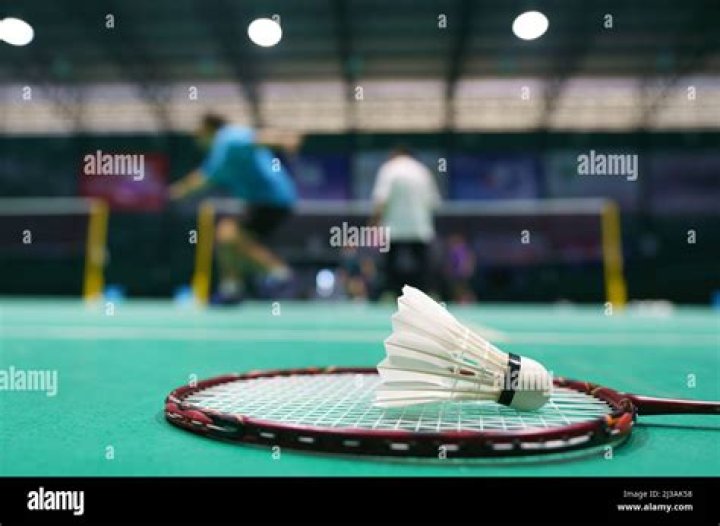 How many hits does a player or team have to get the shuttlecock over the net?