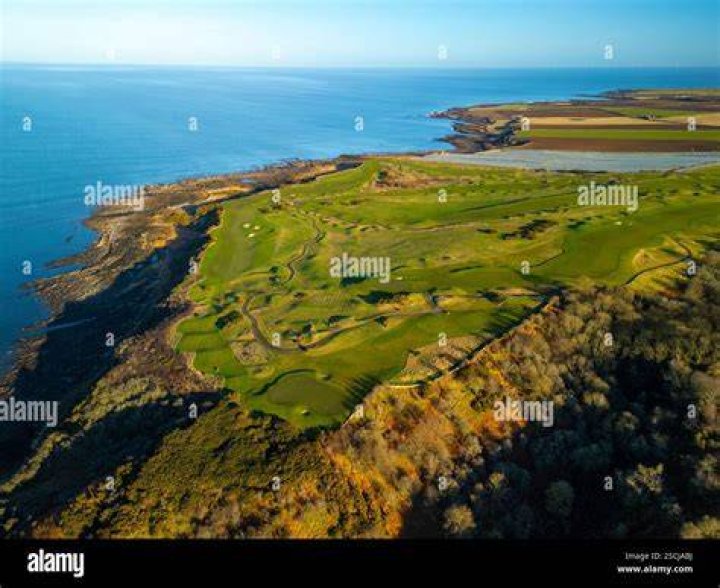 How much does a round of golf cost at St Andrews in Scotland?