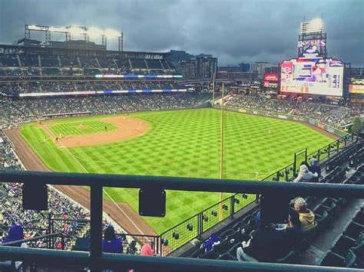 How much further do balls fly at Coors Field?