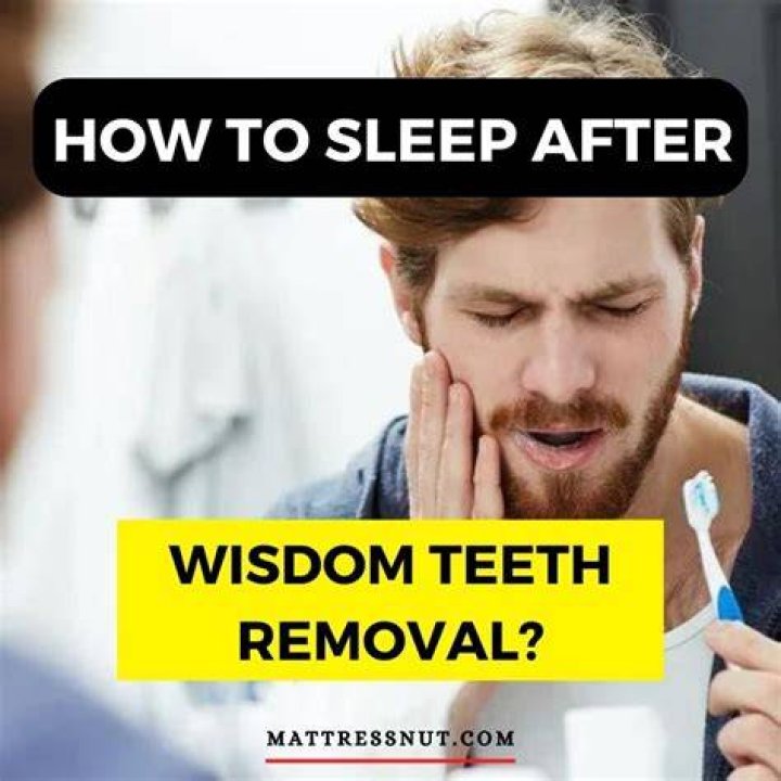 How should I sleep after wisdom teeth removal?