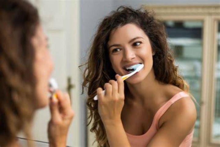 In what order should I brush my teeth?