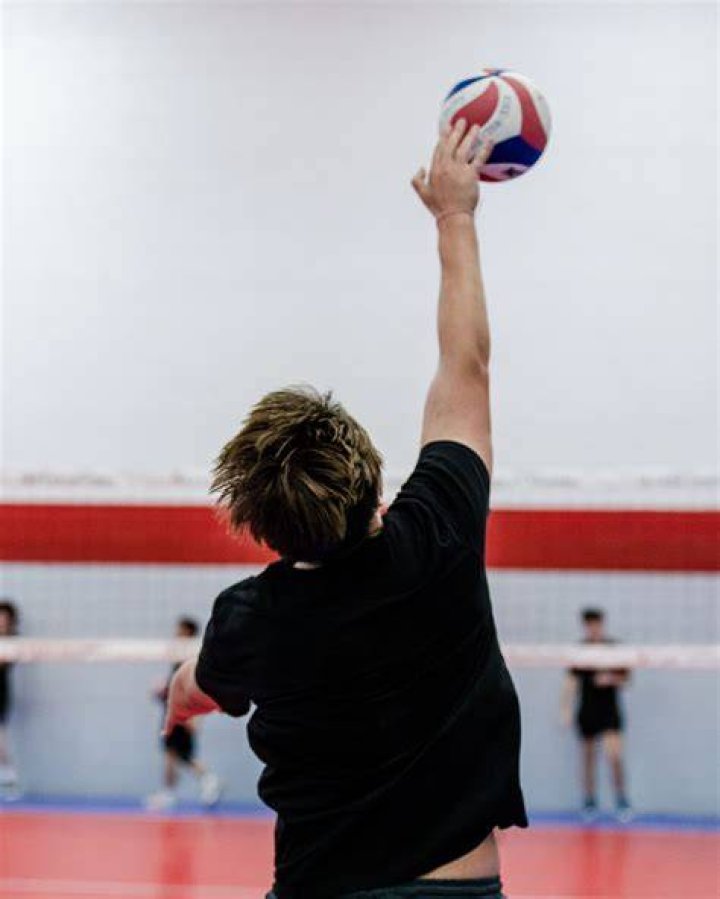 Is serving with a fist illegal in volleyball?