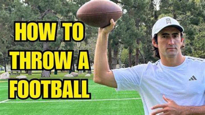 Should you flick your wrist when throwing a football?