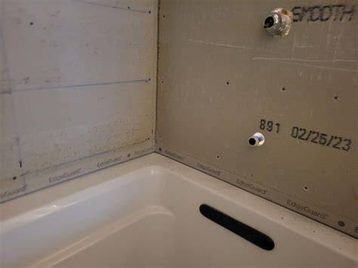 What do you do with a gap between tub and cement board?