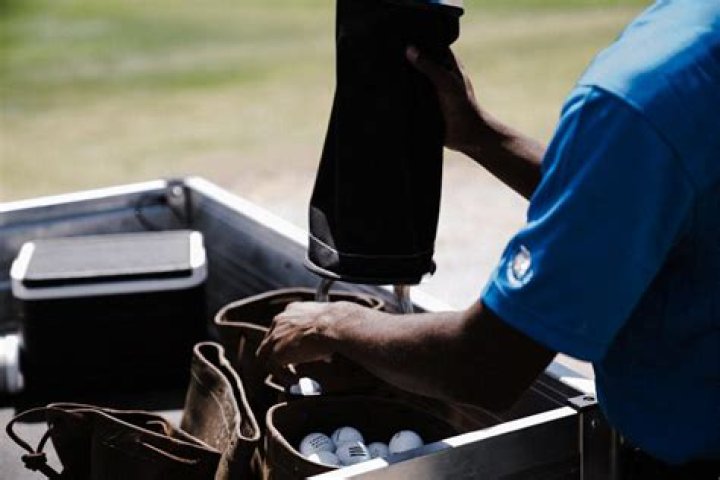 What does it mean when a golfer addresses the ball?