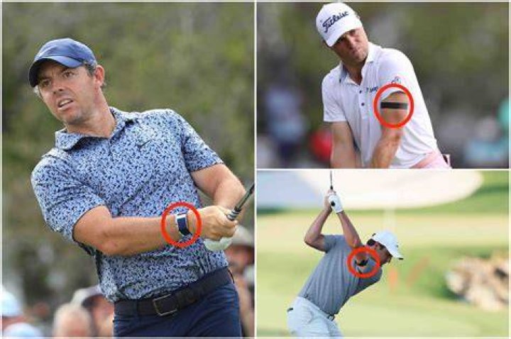 What does Justin Thomas wear on his arm?