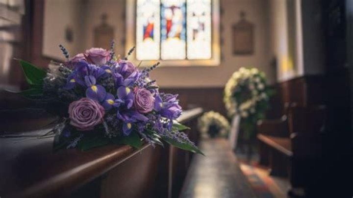 What does purple mean at a funeral?