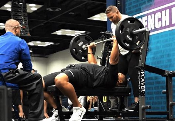 What does the average NFL player bench press?