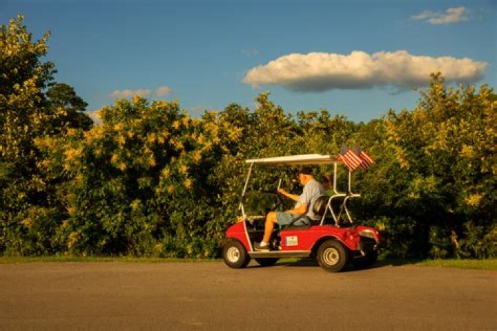 What does the tow switch do on a golf cart?