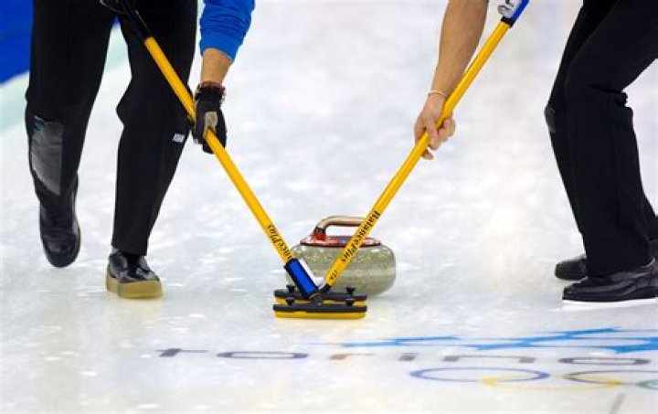 What happens if a sweeper touches a stone in curling?