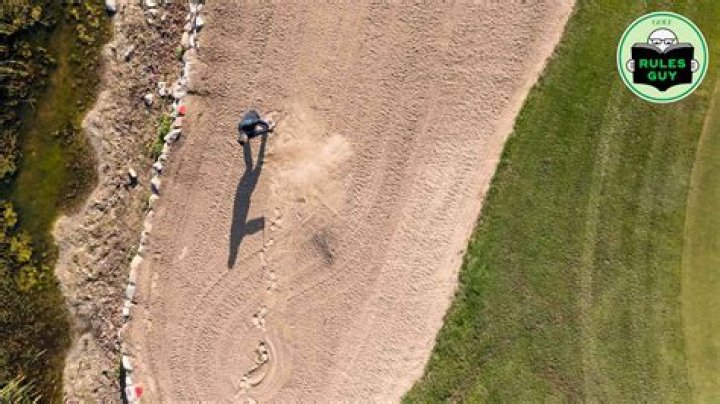 What is the penalty for touching the sand in a bunker?