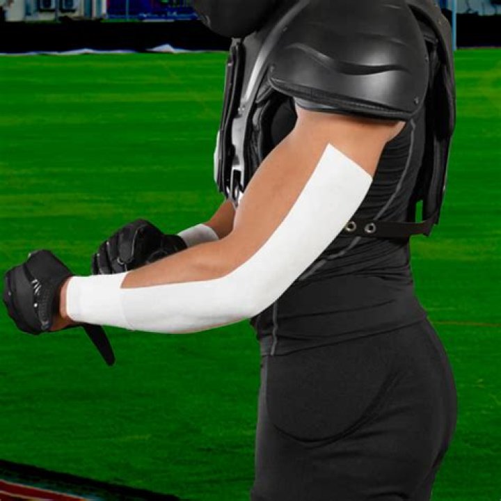 What is the purpose of the tape on the back of football players arms?