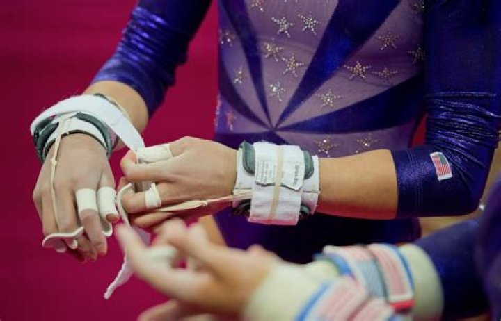 When did gymnasts start wearing grips?