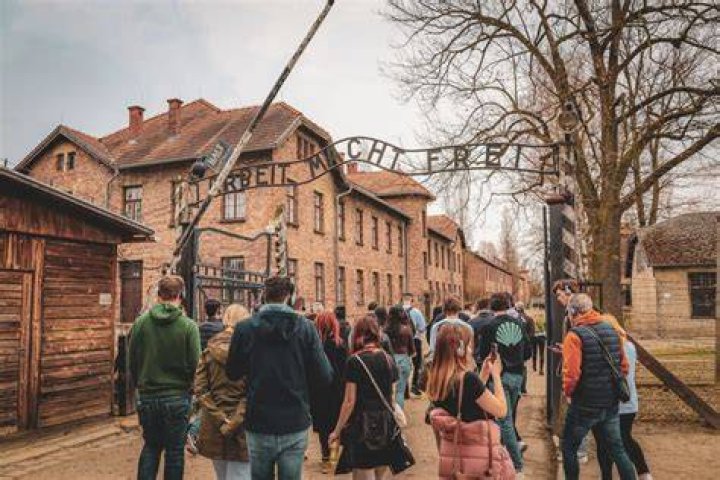 Where do you fly to to go to Auschwitz?