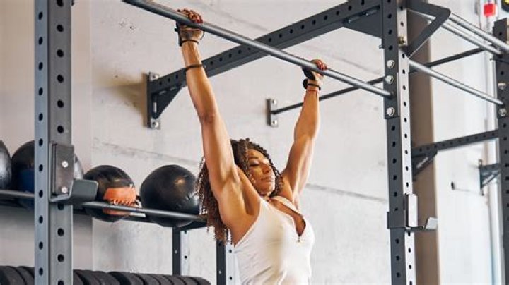 Where should your arms hang in golf?
