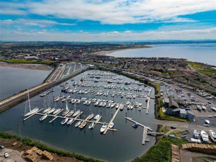 Who owns Troon in Scotland?
