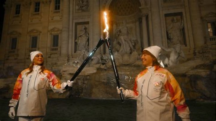 Who ran with the Olympic torch in 1984?