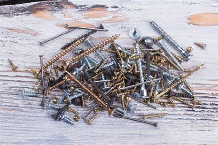 Why are houses built with nails instead of screws?