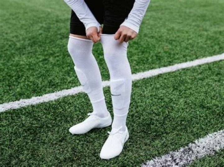 Why do football players wear long socks?