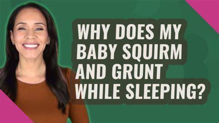 Why does my baby squirm and grunt while sleeping?